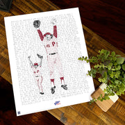 Unframed word art print celebrating the Philadelphia Phillies’ 1980 World Series win lies flat on wood table next to small plant.