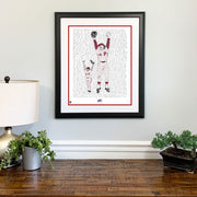 Matted and framed word art print celebrating the Philadelphia Phillies’ 1980 World Series win hangs on wall over wood table.