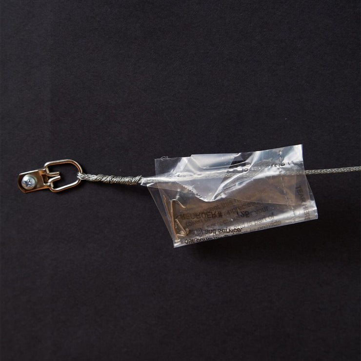 Wire hanger with plastic bag containing nail and hook on back of framed print illustration of Miller Park Brewers Stadium.