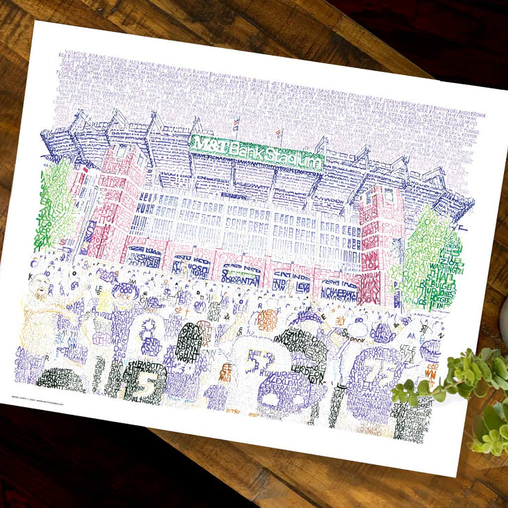 Purple, red, green illustration of front-facing Ravens M&T Stadium and crowd made of words describing stadium on wood table.