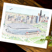Artwork of Soldiers Field Chicago Stadium and city made of handwritten names of every Bear in history since 1920 on table.