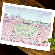 Unframed print of Cincinnati Reds’ stadium word art, handwritten with all Reds’ names through 2019, lies flat on wood table.