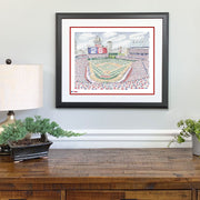 Framed art of Cleveland Indians Stadium made of handwritten names of all Indians players on wall above wood dresser.