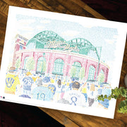 Portrait of Miller Park Milwaukee Brewers Stadium in green and red, crowd in front with hand-drawn words on wood table.