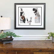 Matted and framed wall word art print celebrating the SF Giants World Series win in 2014 hangs on wall over wood table.