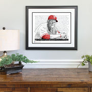Matted and framed word art print of Charlie Manuel, Philadelphia Phillies manager, hangs on wall above wooden table.