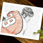 Unframed word art print of Eric Lindros, handwritten with stats from every season in his career, lies flat on wood table.
