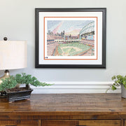 Artist print of Minute Maid Stadium hand-drawn in small rainbow-colored names of every Astro in history above wood dresser.