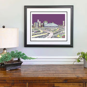 New Orleans Skyline print made of small words of street names, neighborhoods and landmarks of New Orleans above wood dresser.