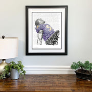 Framed Ray Lewis Ravens football player artwork made of handwritten words about Ravens 2012 championship above dresser.