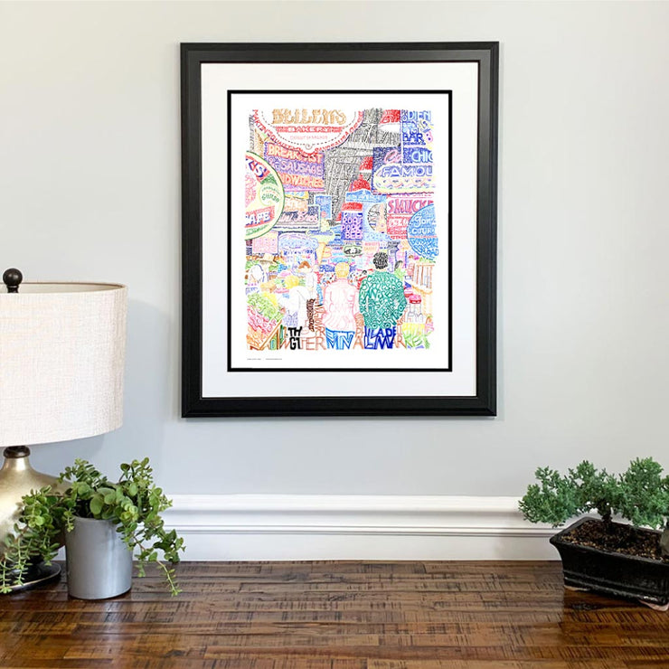  Framed print of Reading Terminal in Philadelphia made of colorful handwritten words about the market above wood dresser.