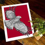 Print of St. Joseph Hawk of St. Joseph's University made with handwritten phrase "The Hawk Will Never Die" in red background.