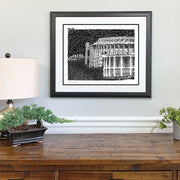 Framed art of Spectrum and Veterans Stadium in Philadelphia made of handwritten words of memorable events above dresser. 