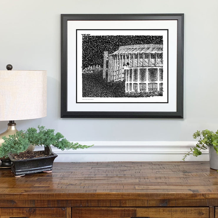 Framed art of Spectrum and Veterans Stadium in Philadelphia made of handwritten words of memorable events above dresser. 